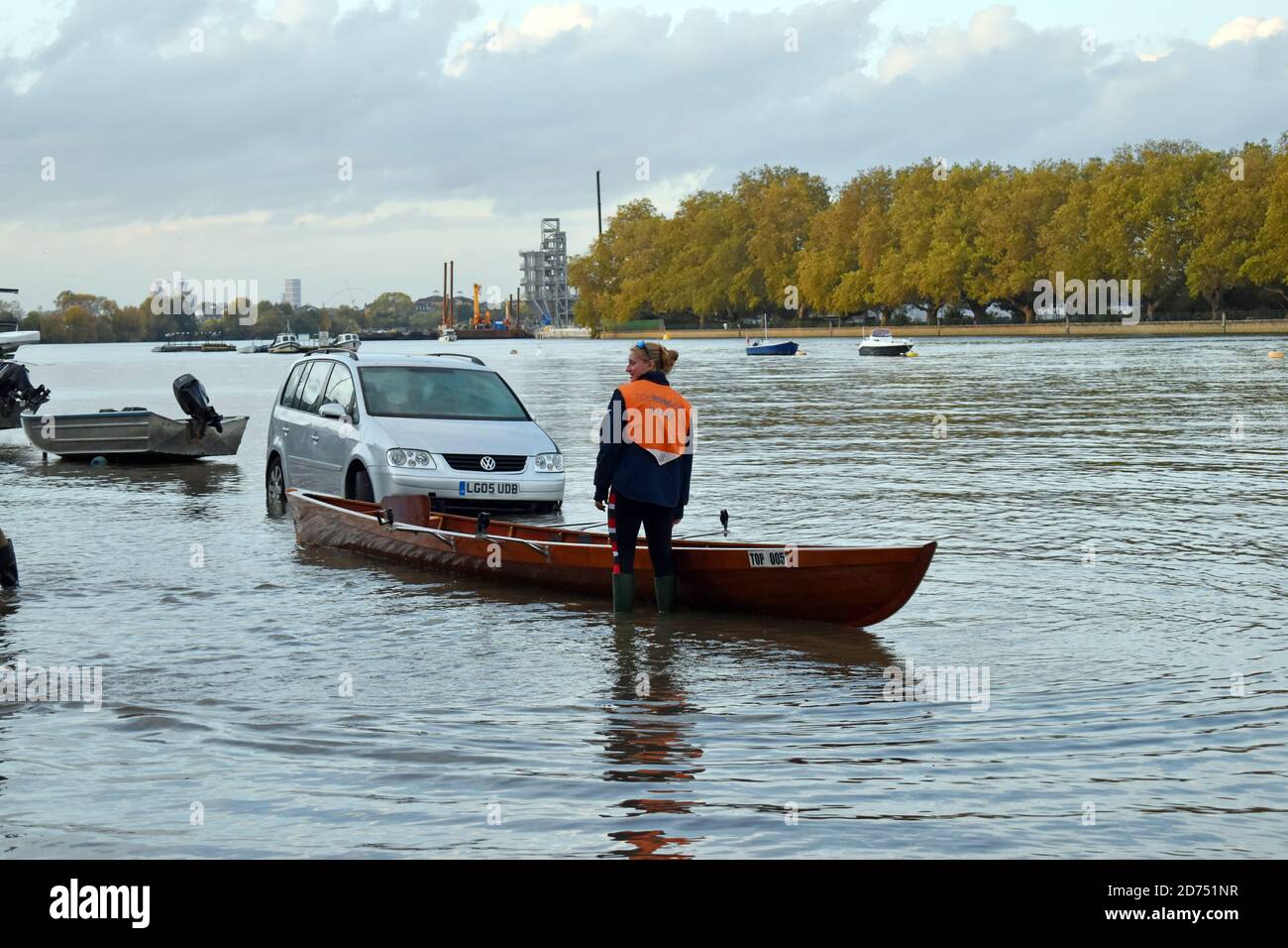 London, UK. 20th Oct, 2020. Unusually high spring tide on the Thames floods Putney Embankment road in front of rowing clubs. Credit: JOHNNY ARMSTEAD/Alamy Live News Stock Photo