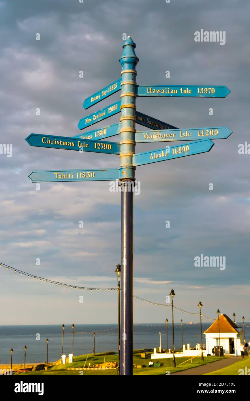 A Whitby Signpost for Various Places Around the World and the Direction and Distances to Them Stock Photo