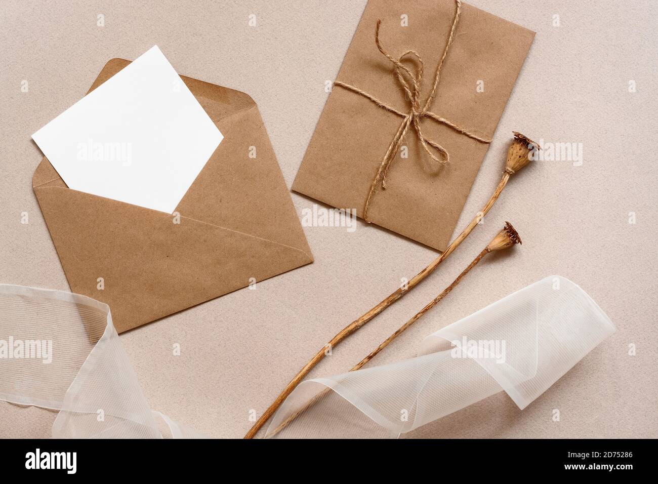 Download Blank Card Mockup In Craft Envelope Silk Ribbon And Dry Poppy Boxes On Brown Paper Background Feminine Wedding Invitation Template Top View Flat L Stock Photo Alamy