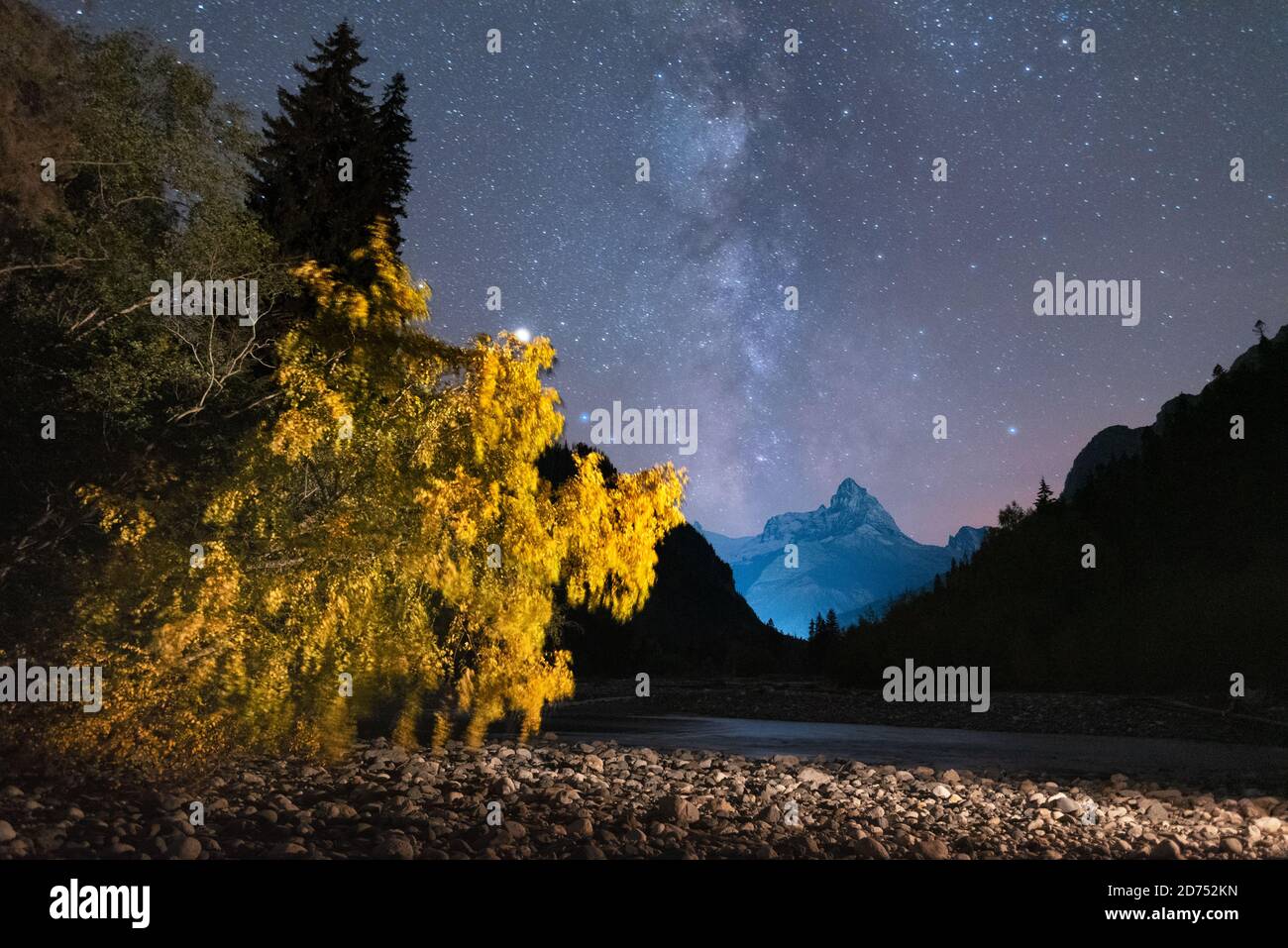 Milky way in the sky over Mount Dombay and orange autumn tree Stock ...