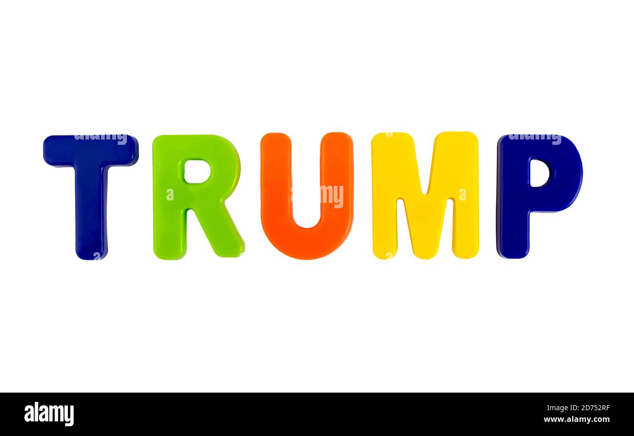The last name of US President Donald Trump written in multicolored plastic letters on a white background. Concept for the electoral campaign. Stock Photo