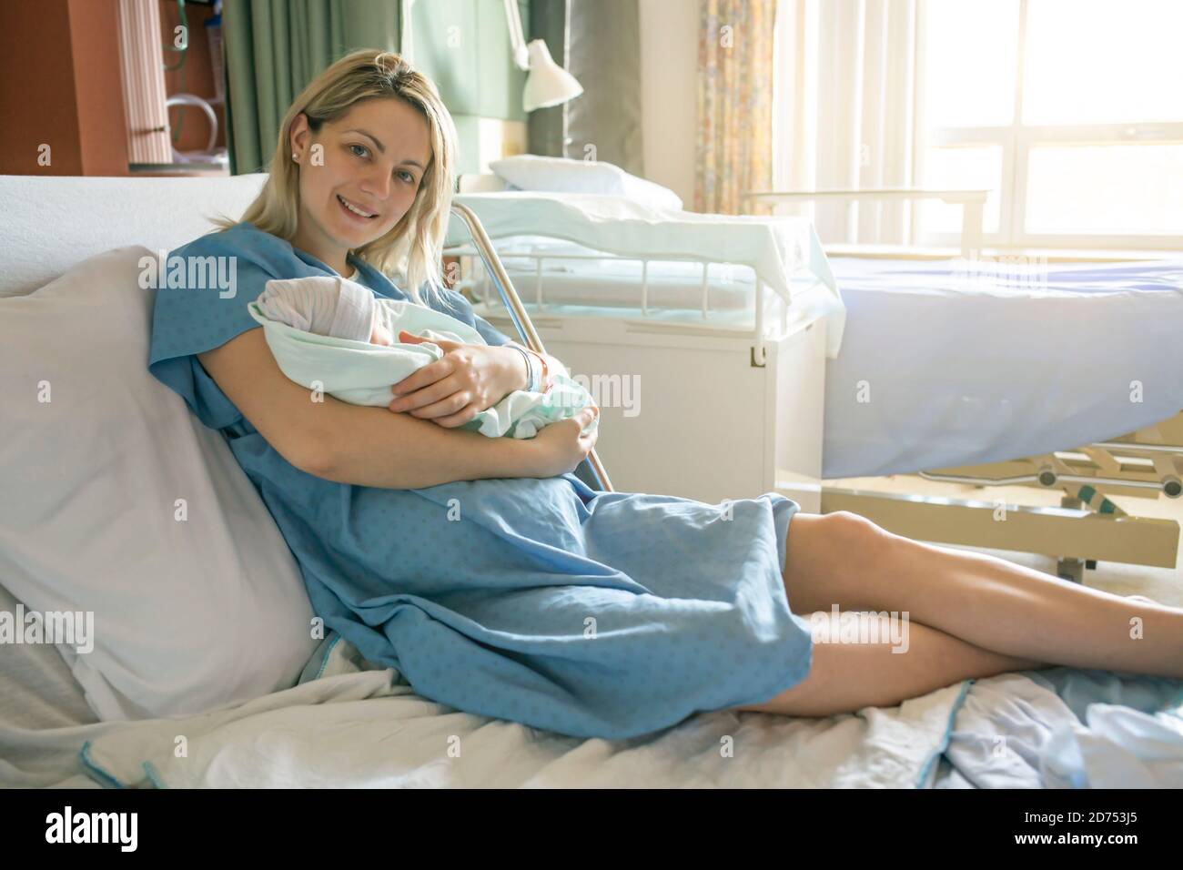 Mother with her newborn baby at the hospital a day after a natural