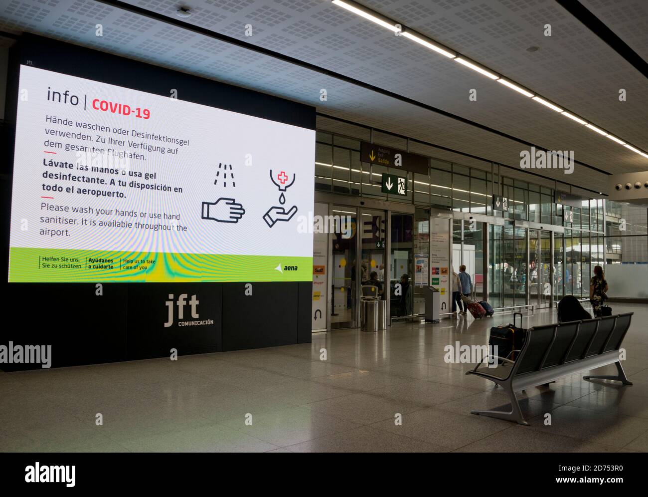 Tourists wearing face masks and signs of warning due to Covid19