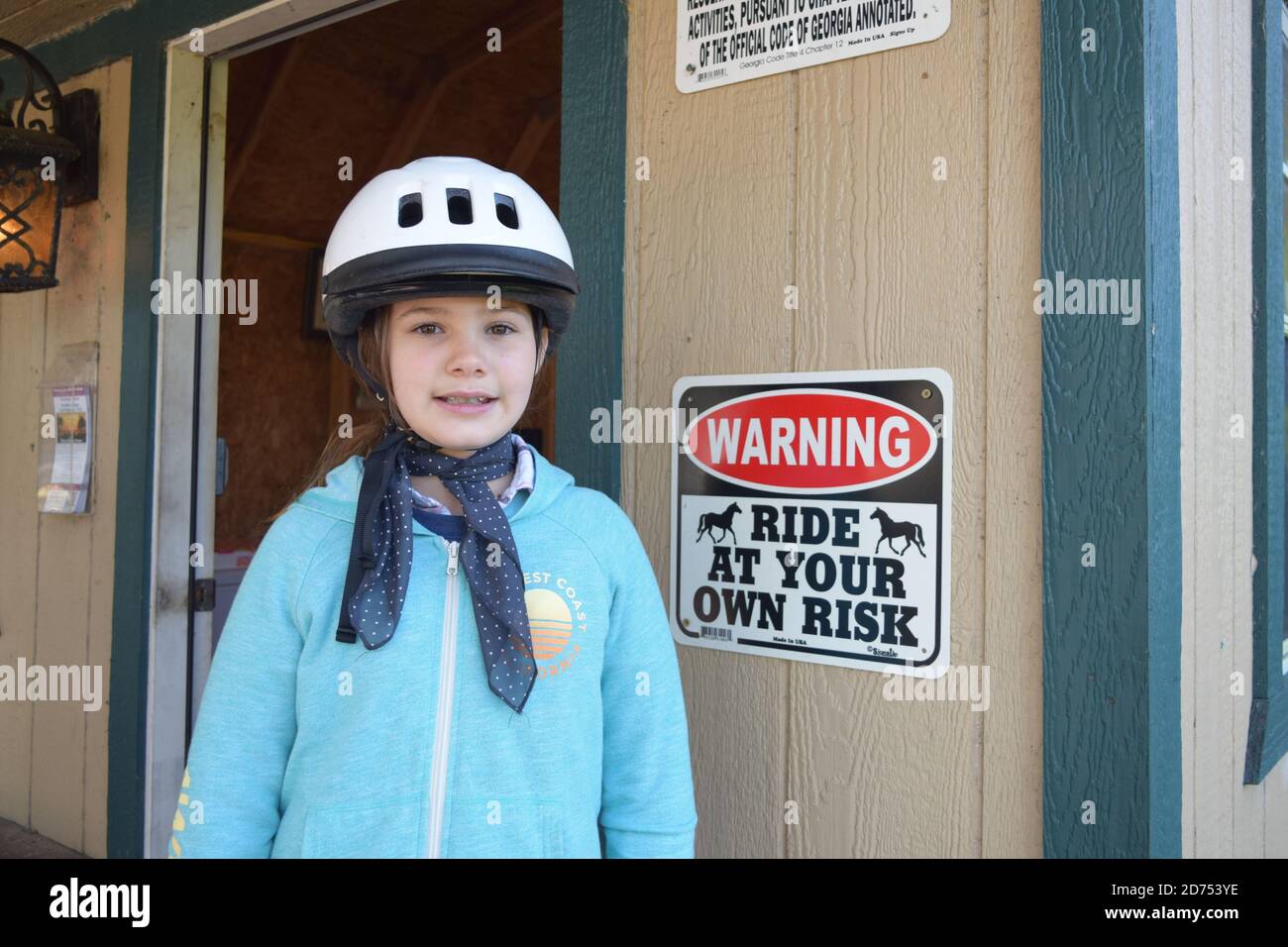 Ride At Your Own Risk Girl Ready To Go Horseback Riding Stock Photo ride-at-your-own-risk-girl-ready-to-go-horseback-riding-stock-photo