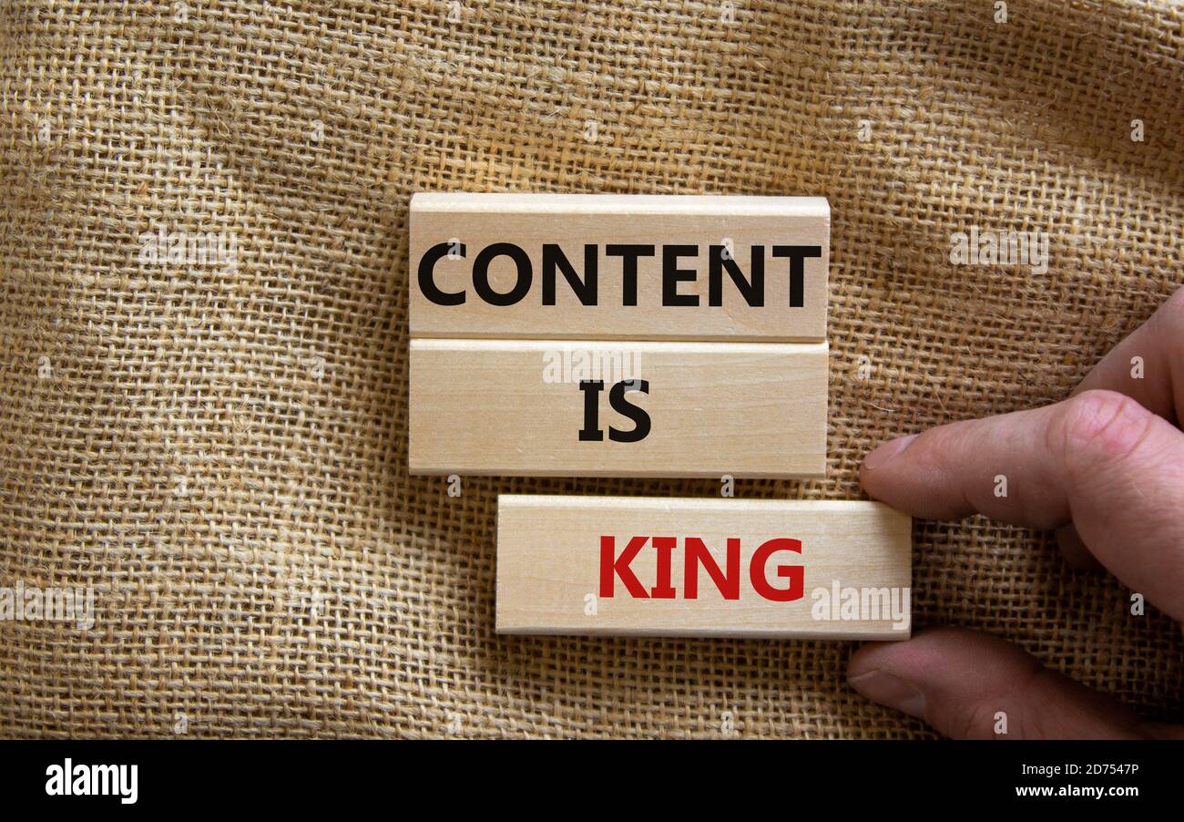 Wooden blocks form the words 'content is king' on canvas background