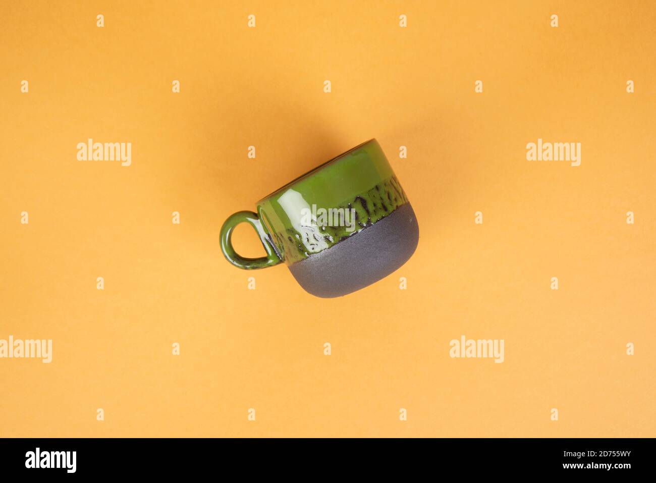 porcelain coffee cups on yellow background Stock Photo