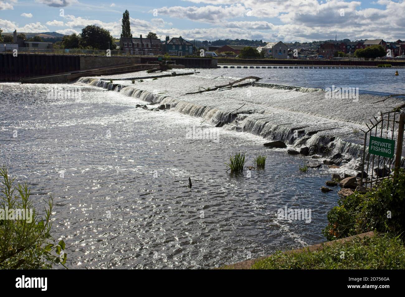 Weir on the River Exe, contrejour, Exeter, Devon, England, UK. Stock Photo