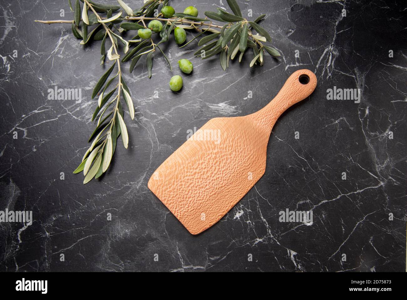 hand carved wooden kitchen tools on the table Stock Photo