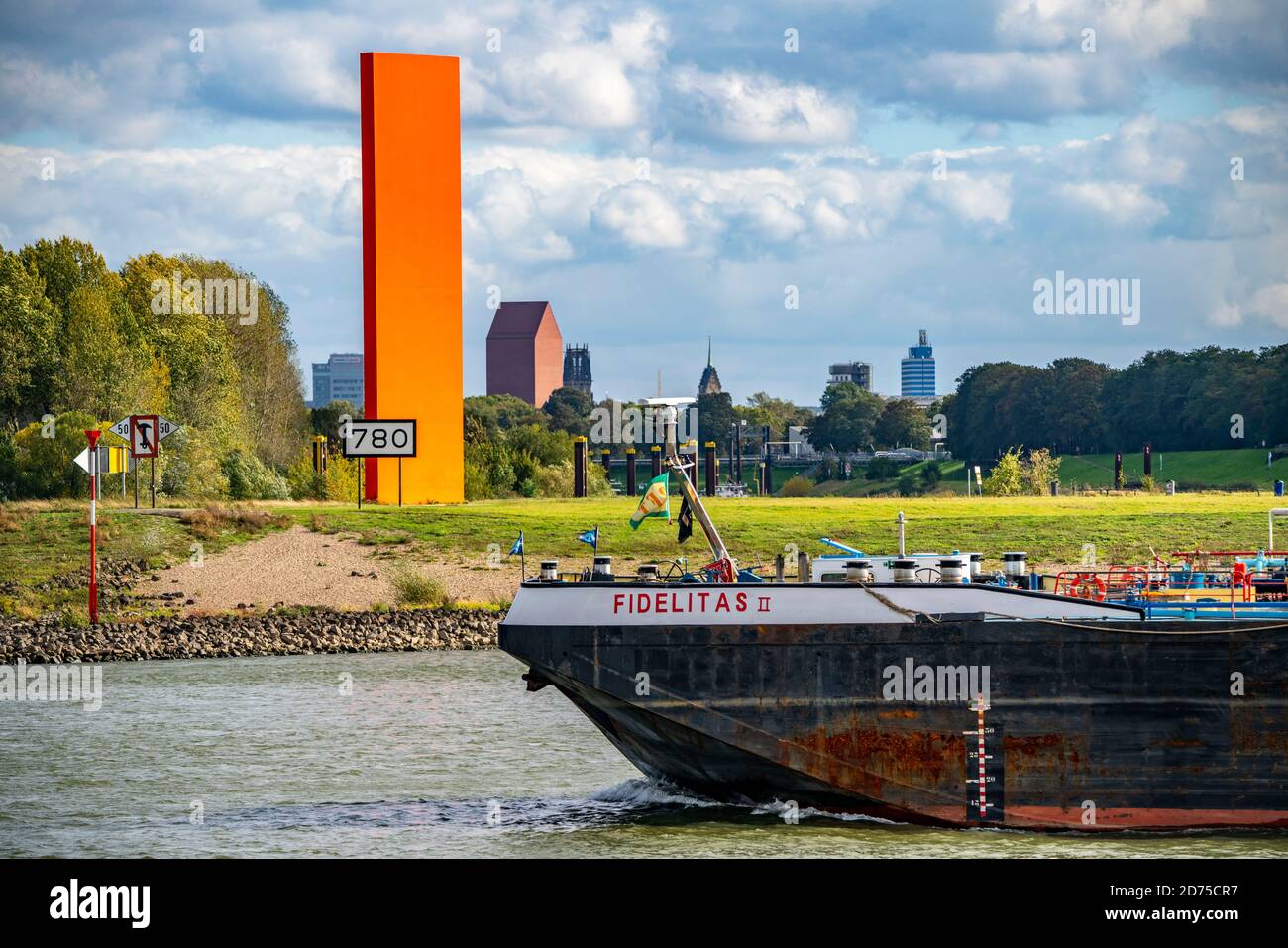 The Rhine Orange sculpture at the mouth of the Ruhr and Rhine, skyline of Duisburg city centre, tower of the NRW Landesarchiv, town hall tower and Sal Stock Photo