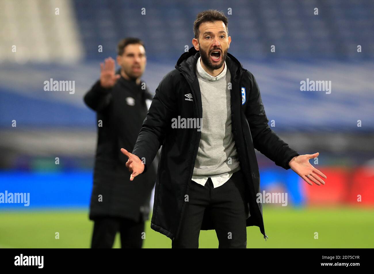 Huddersfield Town manager Carlos Corberan instructs his players during the Sky Bet Championship match at The John Smith's Stadium, Huddersfield. Stock Photo