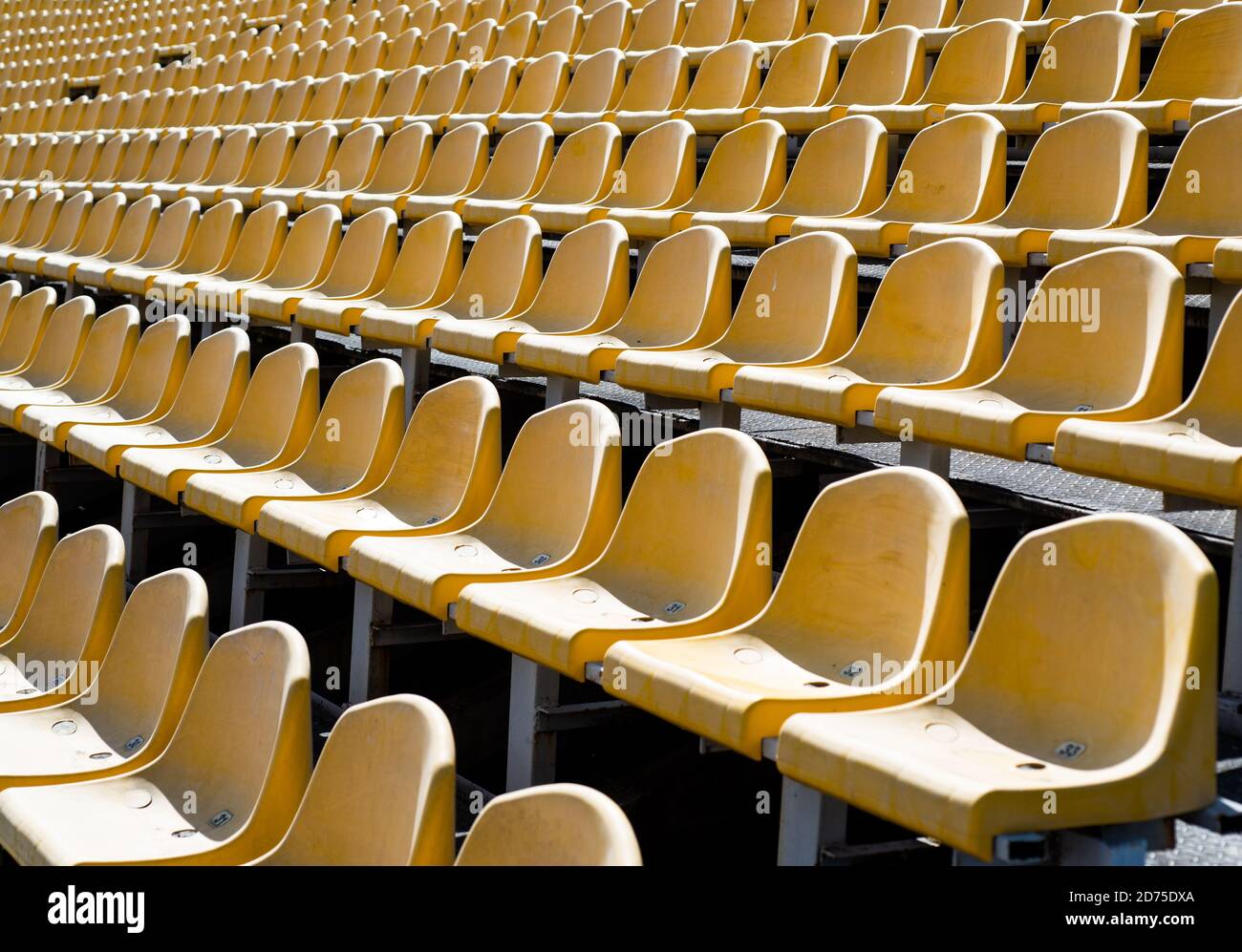 concept of fans. chairs for audience. cultural environment concept. color  and symmetry. empty seats. modern stadium. yellow tribunes. seats of  tribune on sport stadium. empty outdoor arena Stock Photo - Alamy