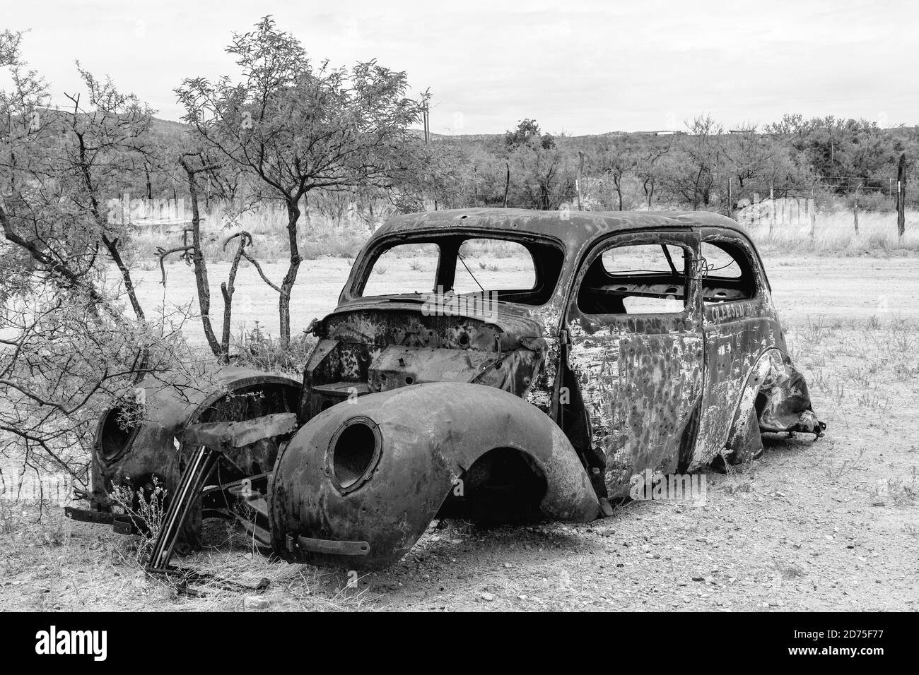 Rusty abandoned car body used for target practice. Gleeson, Arizona, USA Stock Photo