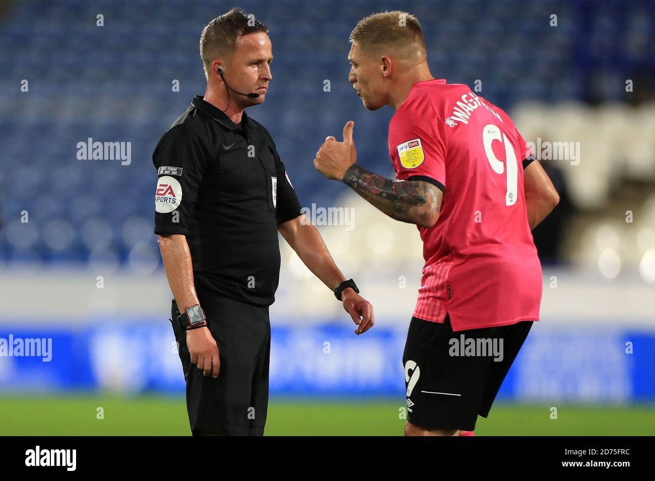 Derby County's Martyn Waghorn (right) in discussion with referee David Webb during the Sky Bet Championship match at The John Smith's Stadium, Huddersfield. Stock Photo