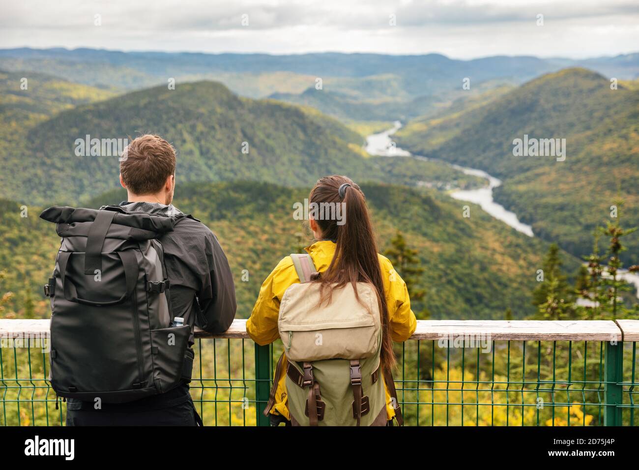 Hike couple camping with backpacks in Quebec National Park in Autumn  season, Canada forest travel lifestyle. Tourists looking at view of Jacques  Stock Photo - Alamy