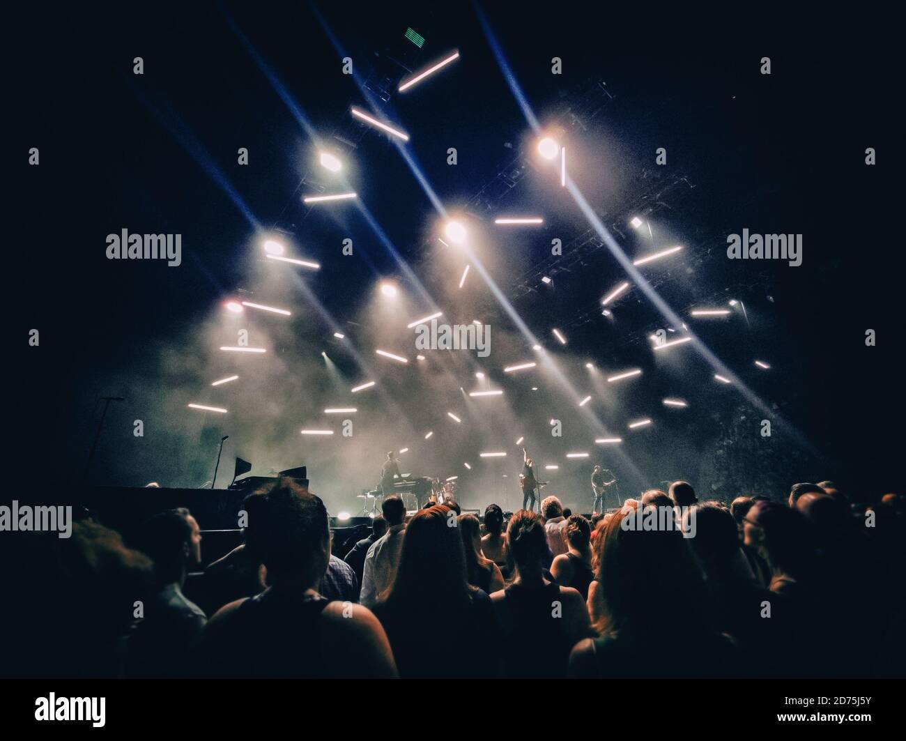 Concert show background with crowd silhouettes listening to acoustic guitar  music live performance by rock band on stage. Dark with lights. Mobile  Stock Photo - Alamy