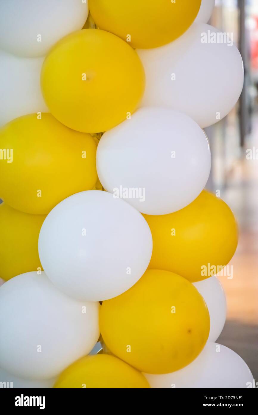 Yellow-white beautiful balloons for decoration Stock Photo - Alamy