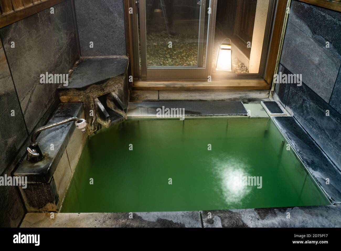 Japanese hot springs bath tub indoors. Stock Photo