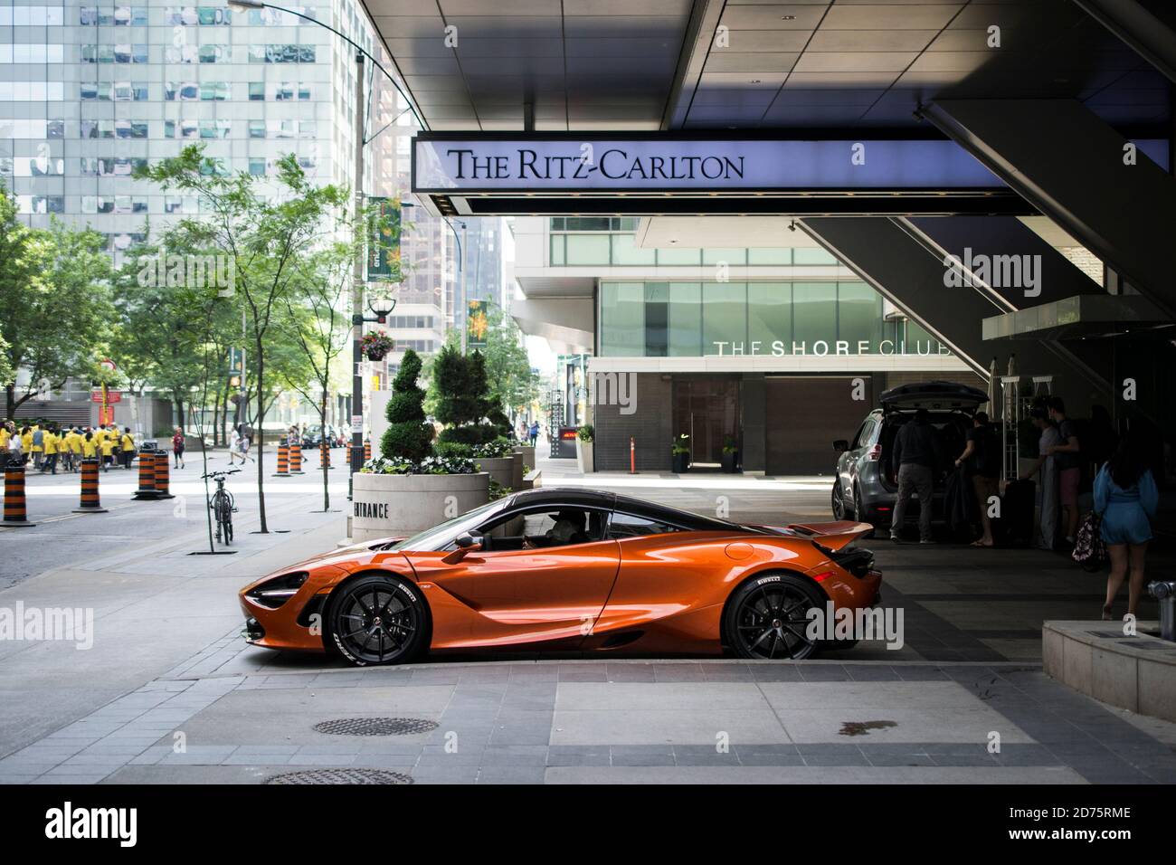 A Mclaren Supercar is parked outside of the Ritz Carlton in Downtown Toronto Ontario Canada Stock Photo