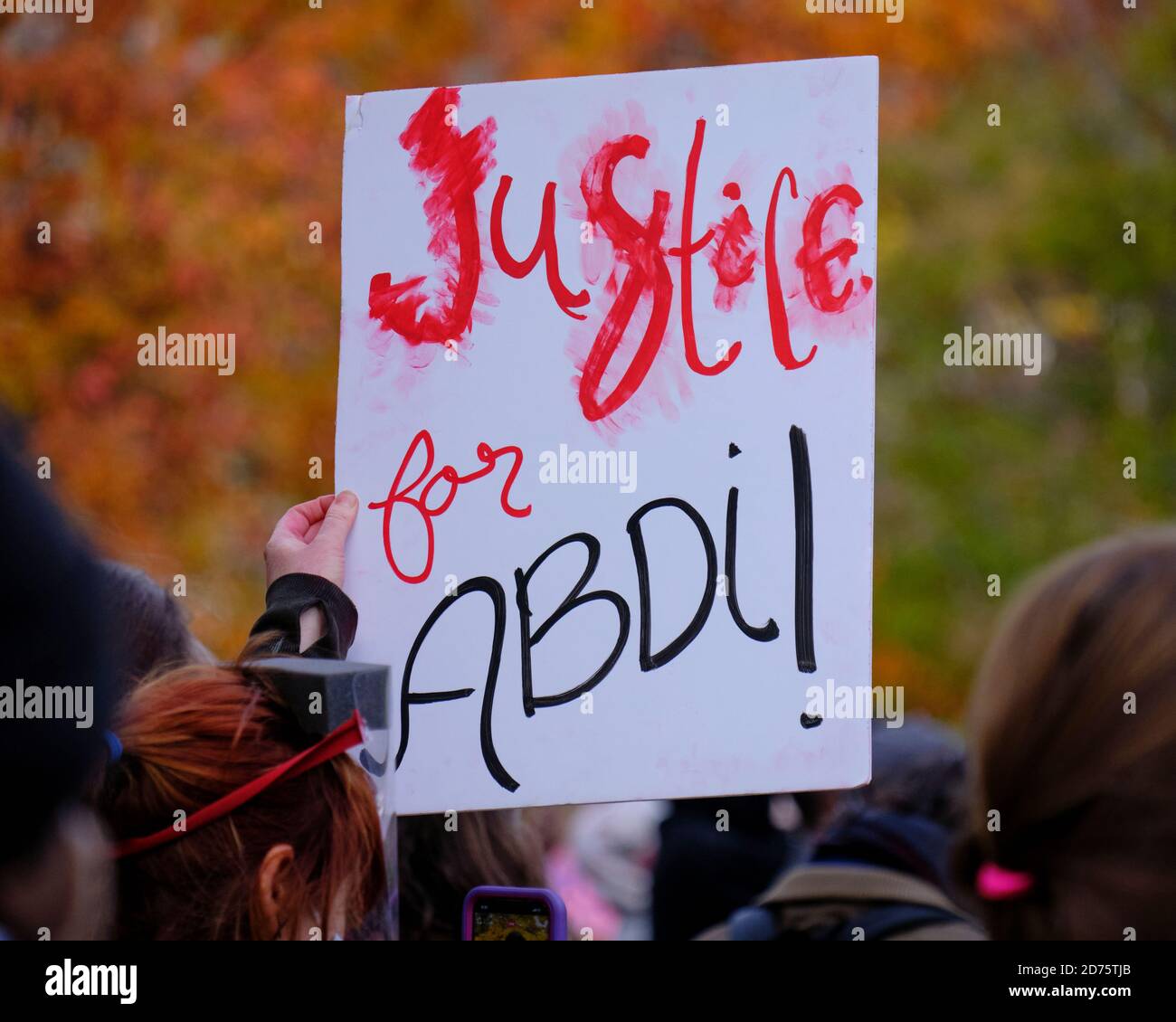 Ottawa, Canada. October 20th, 2020. About 500 people took to the street demanding justice for Abdirahman Abdi, who was killed during his arrest in 2016. Earlier today, the court found the arresting officer Ottawa police Const. Daniel Montsion not guilty on all charges related to the death. This is another case in the ongoing community battle between the police and black members of the community. Abdi had come to Canada from Somalia in 2009 and at the time of his death was 37. Credit: meanderingemu/Alamy Live News Stock Photo