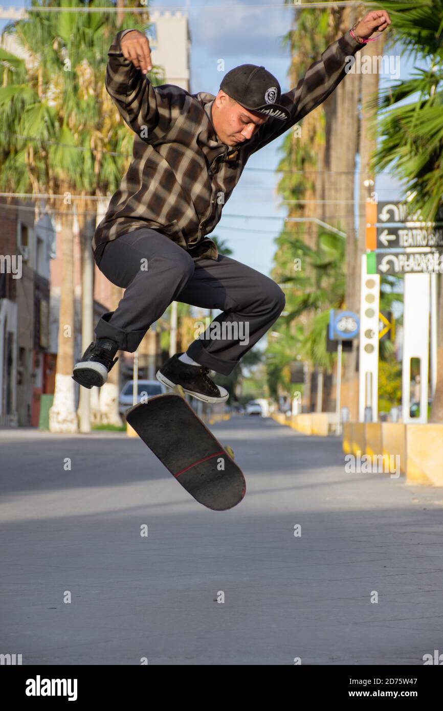wearing baggy clothes and longboarding 