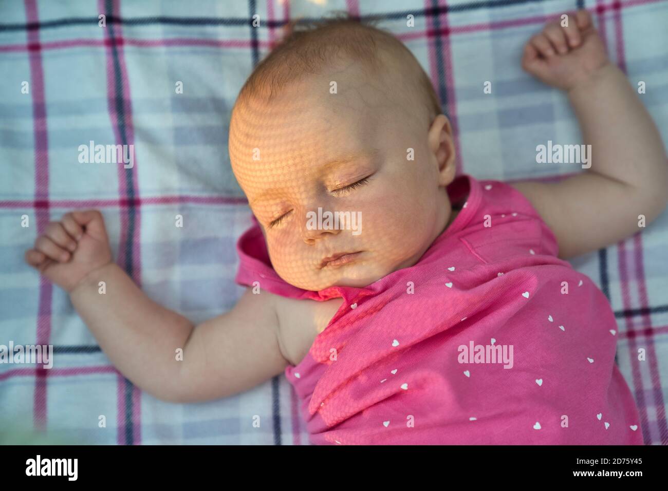 Baby sleeping outside on the bed Stock Photo Alamy