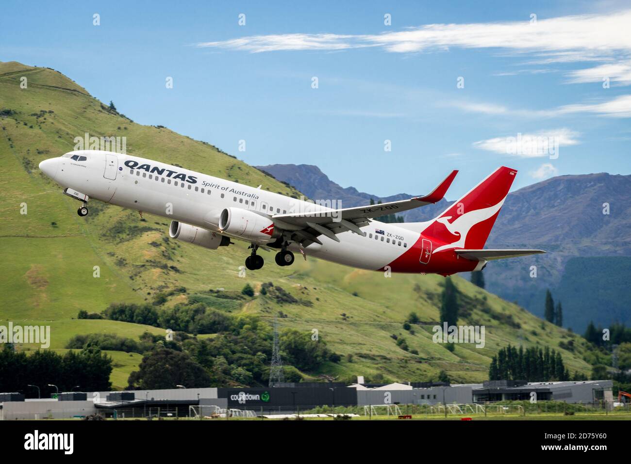 Queenstown, NEW ZEALAND - DEC 9, 2016: Airplane of Qantas Airways takes off from runway in Queenstown airport, Queenstown, South Island of New Zealand Stock Photo