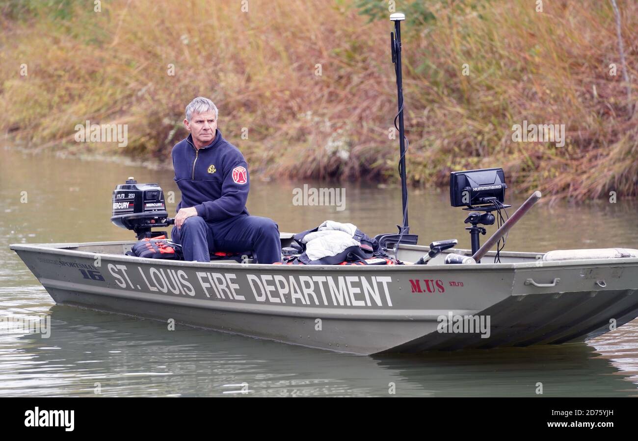 St. Louis, United States. 20th Oct, 2020. St. Louis fire captain Ray Hummel navigates a boat through a canal in Forest Park in St. Louis on Tuesday, October 20, 2020. The firefighters joined the FBI and the Missouri State Highway Patrol divers, looking for a weapon used in a triple shooting death. Photo by bill Greenblatt/UPI Credit: UPI/Alamy Live News Stock Photo