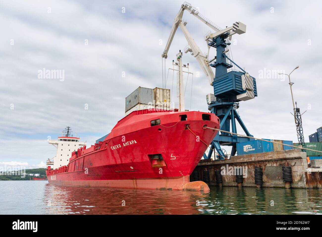 Portal crane unloading Russian cargo container ship Sasco Angara