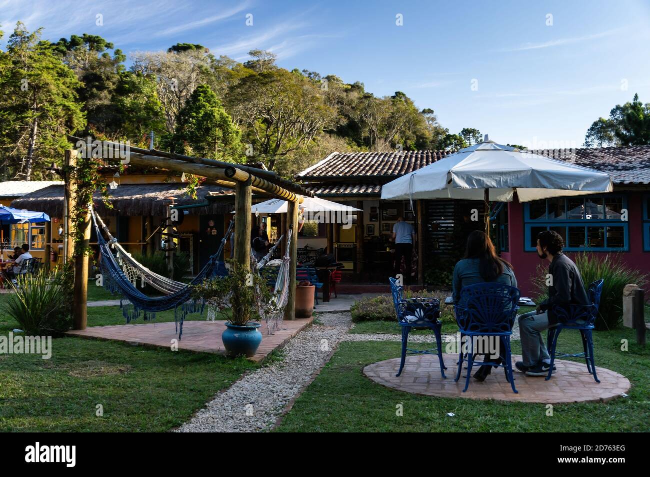 Cozy and beautifully decorated backyard garden of Moara Cafe, where costumers can relax while enjoy some coffee. Cunha, Sao Paulo - Brazil. Stock Photo