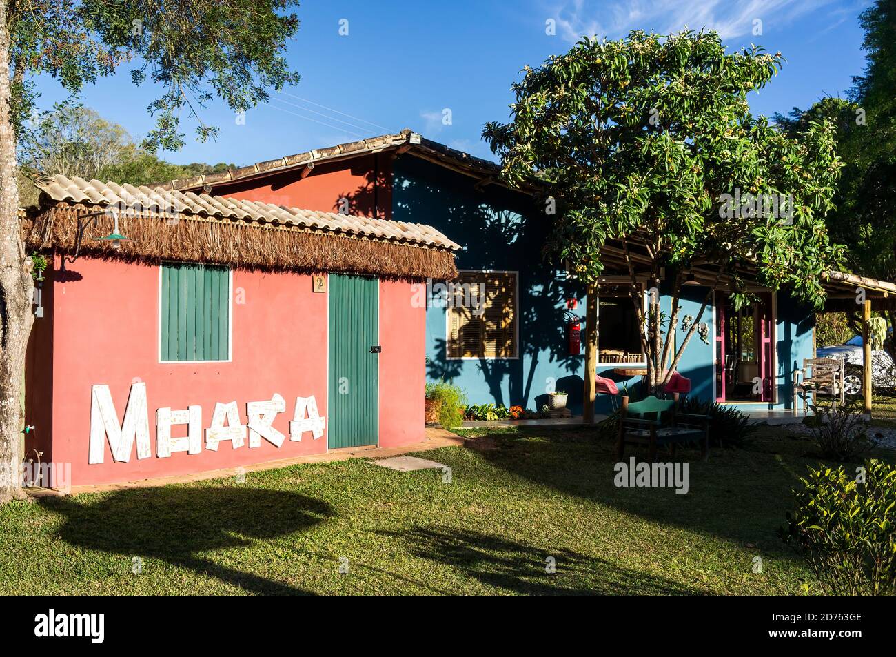 Cozy and beautifully decorated backyard garden of Moara Cafe under late ...