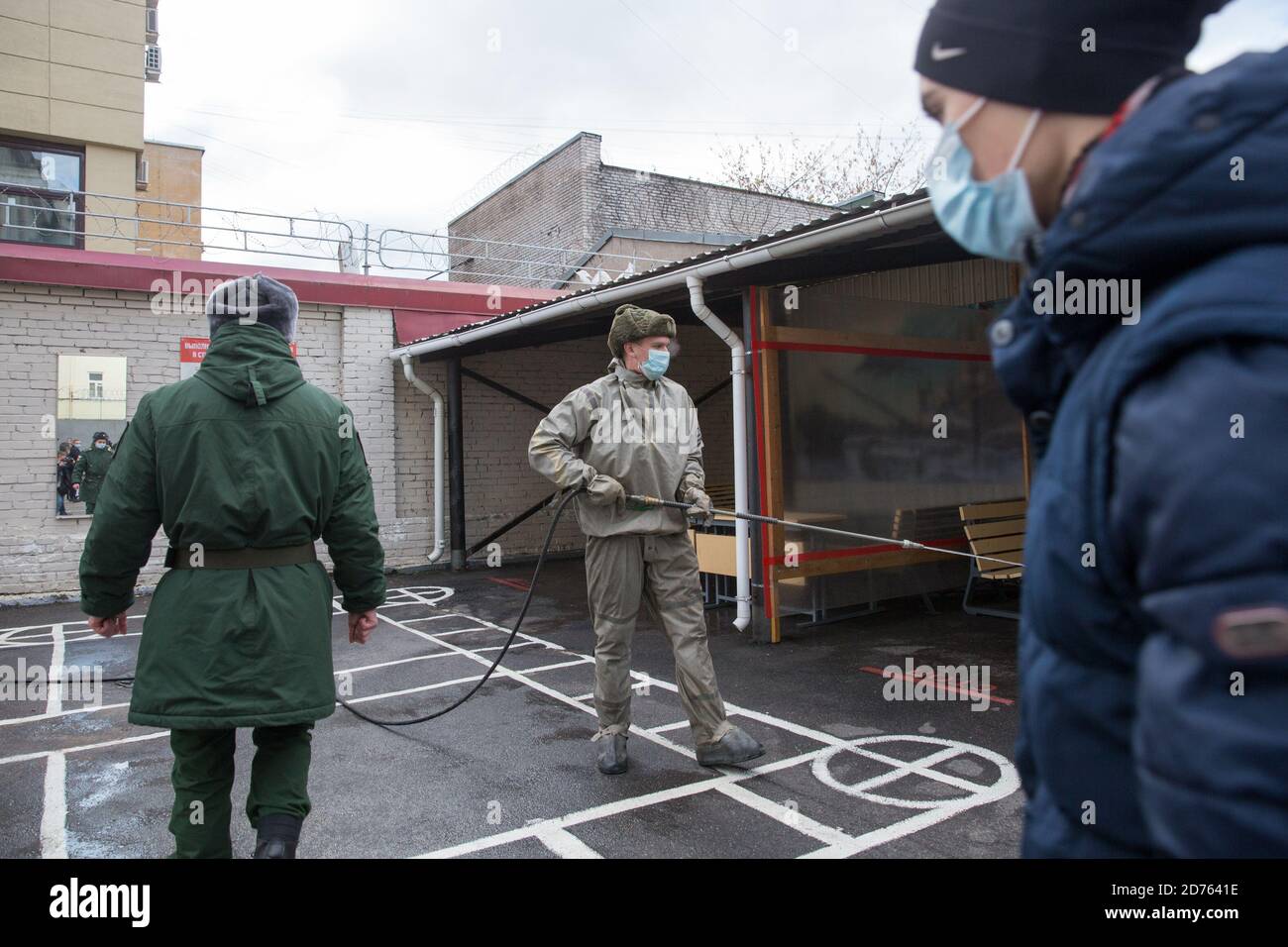 St. Petersburg, Russia. 20th Oct, 2020. A staff member (C) disinfects an army recruitment center in St. Petersburg, Russia, Oct. 20, 2020. Russia's ongoing autumn army recruitment started on Oct. 1 and will last until Dec. 31. In order to be conscripted, candidates must be Russian citizens aged between 18 and 27, and pass a physical examination. Credit: Irina Motina/Xinhua/Alamy Live News Stock Photo
