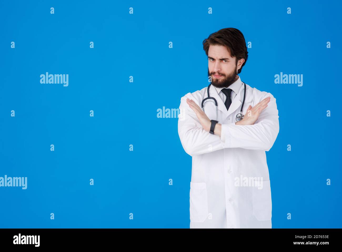 Hispanic man doctor stethoscope crossing hi-res stock photography and ...