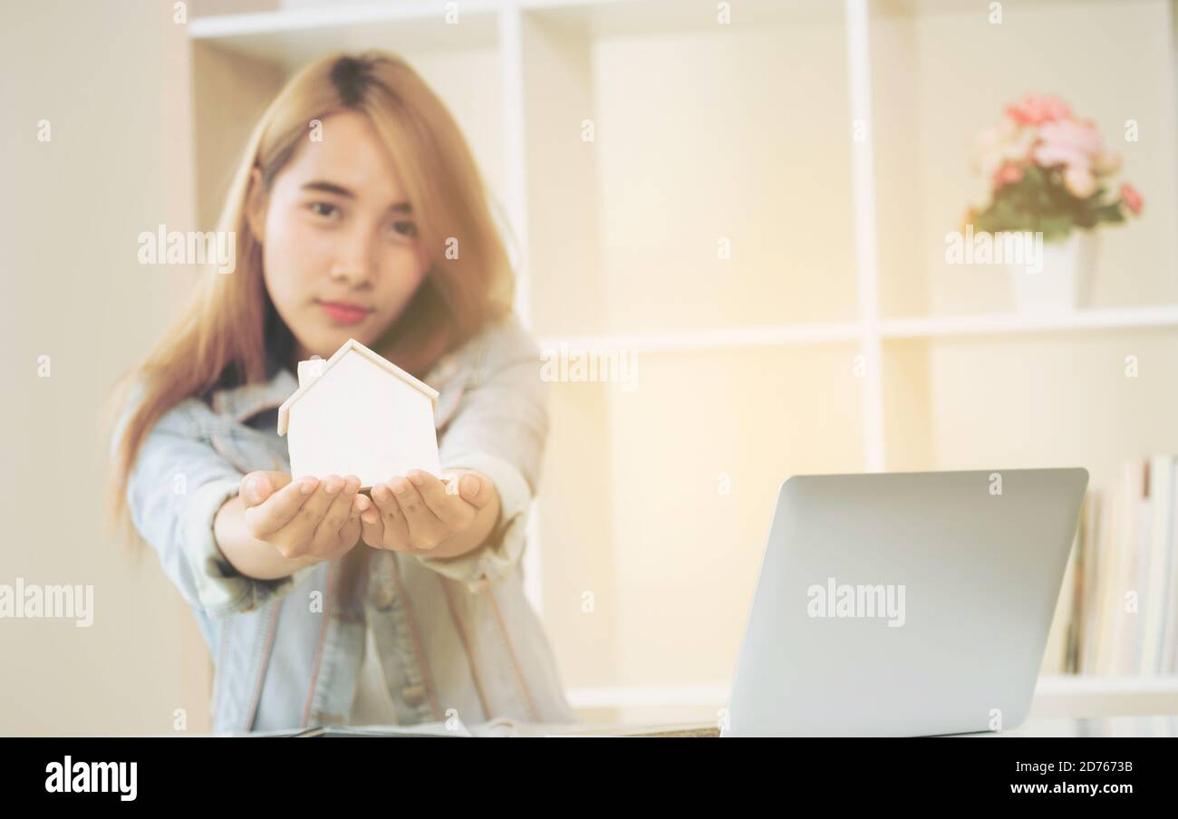 Young woman planning to buy house. Decision making in real estate and