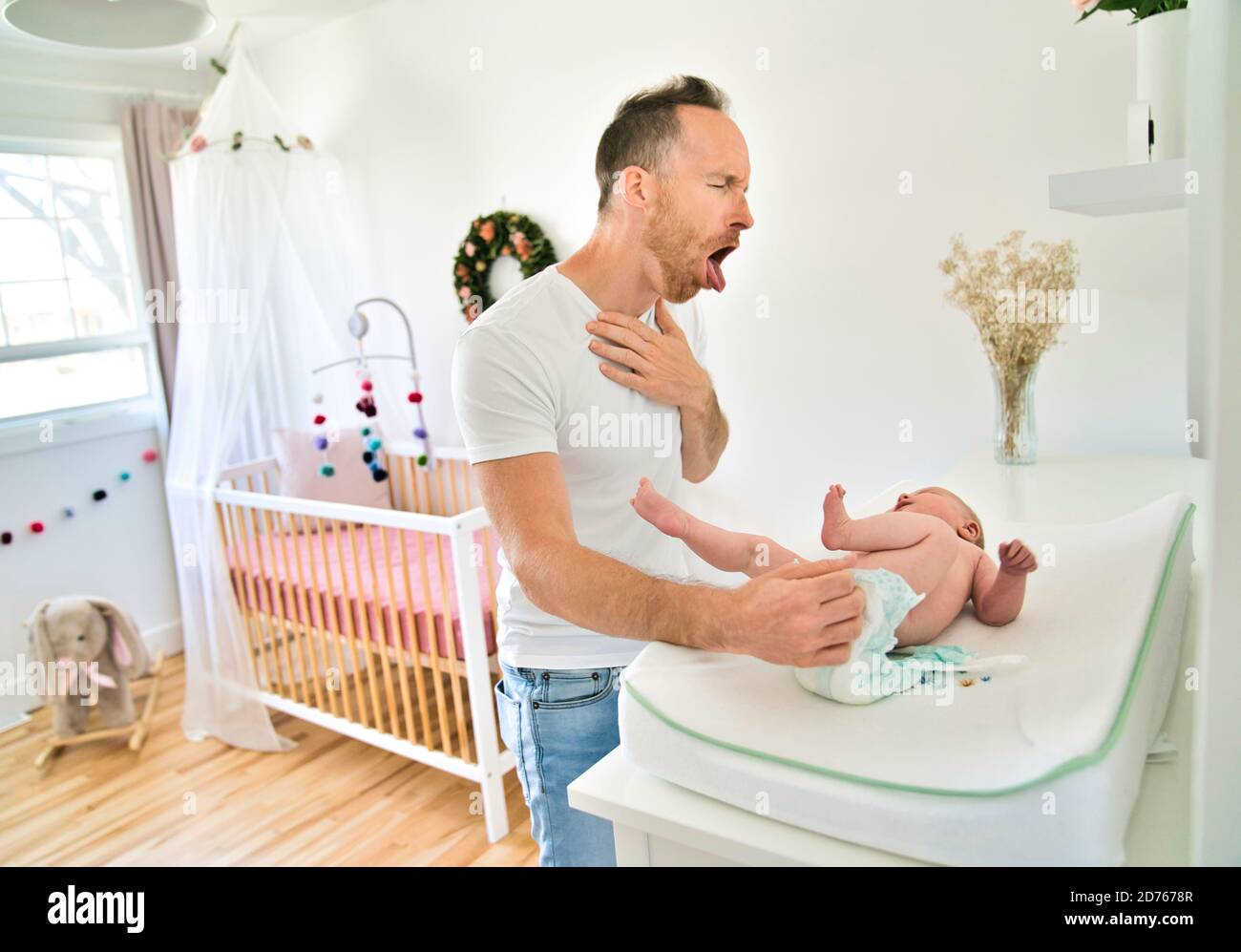 A Father Changing Baby's Diaper In nursery Stock Photo Alamy