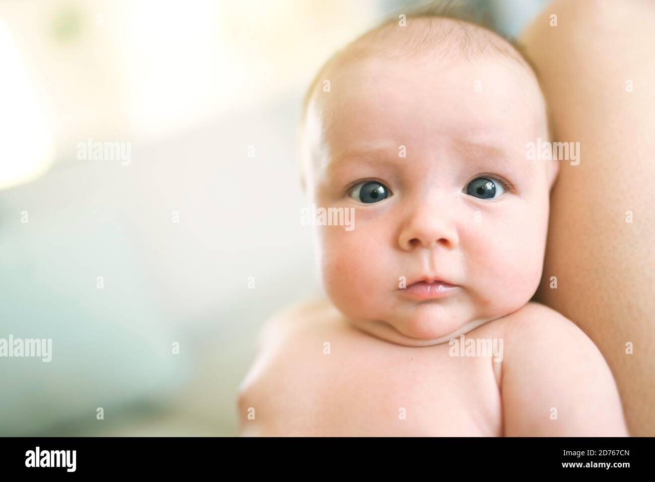 mother with her newborn baby on knee Stock Photo Alamy