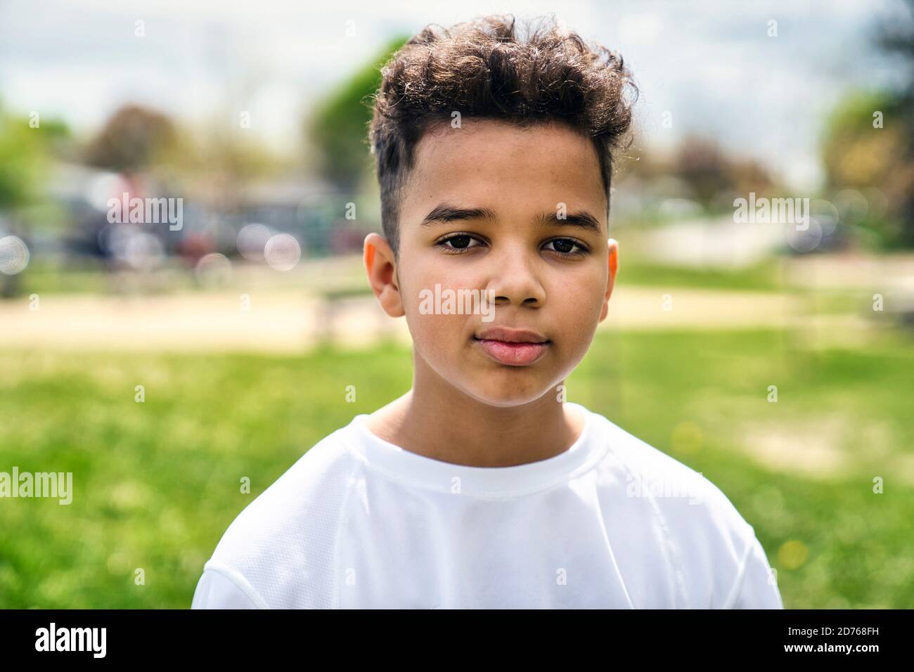 Teen afro american boy in the garden on the day time Stock Photo