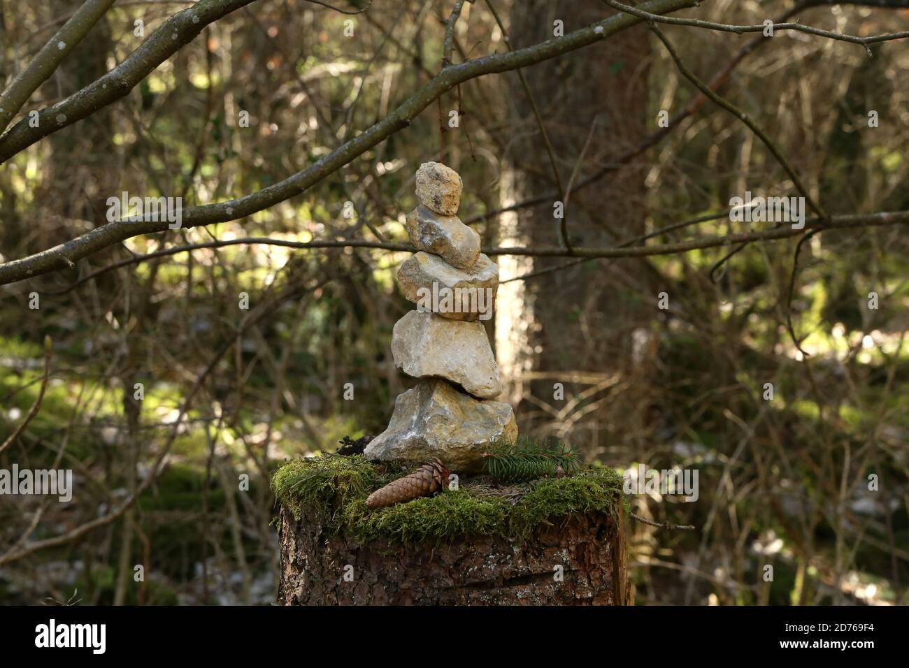 Pyramid Stump Pyramid built of stones stands in a forest on a stump Stock Photo - Alamy