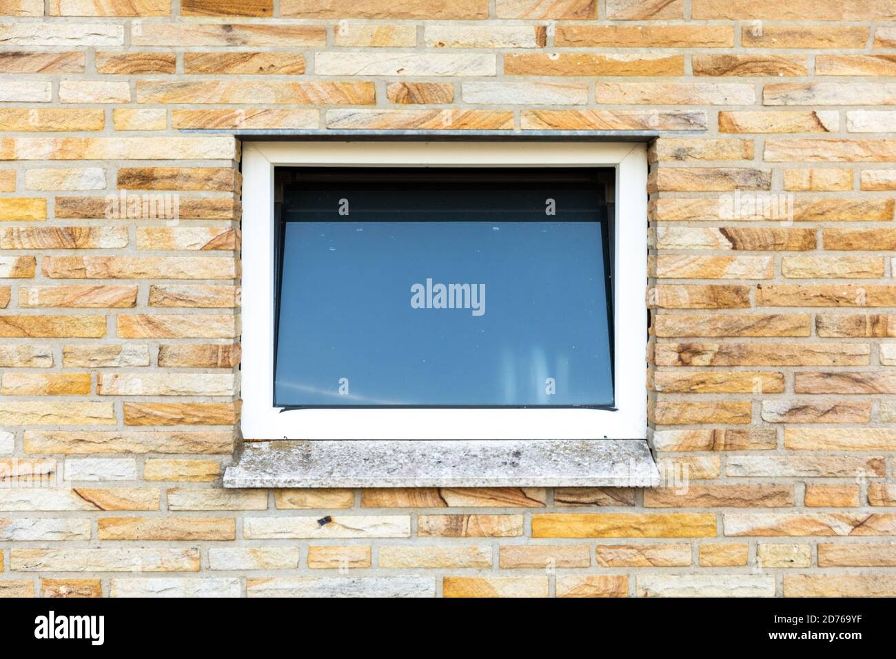 Small square window in the brick wall building Stock Photo - Alamy