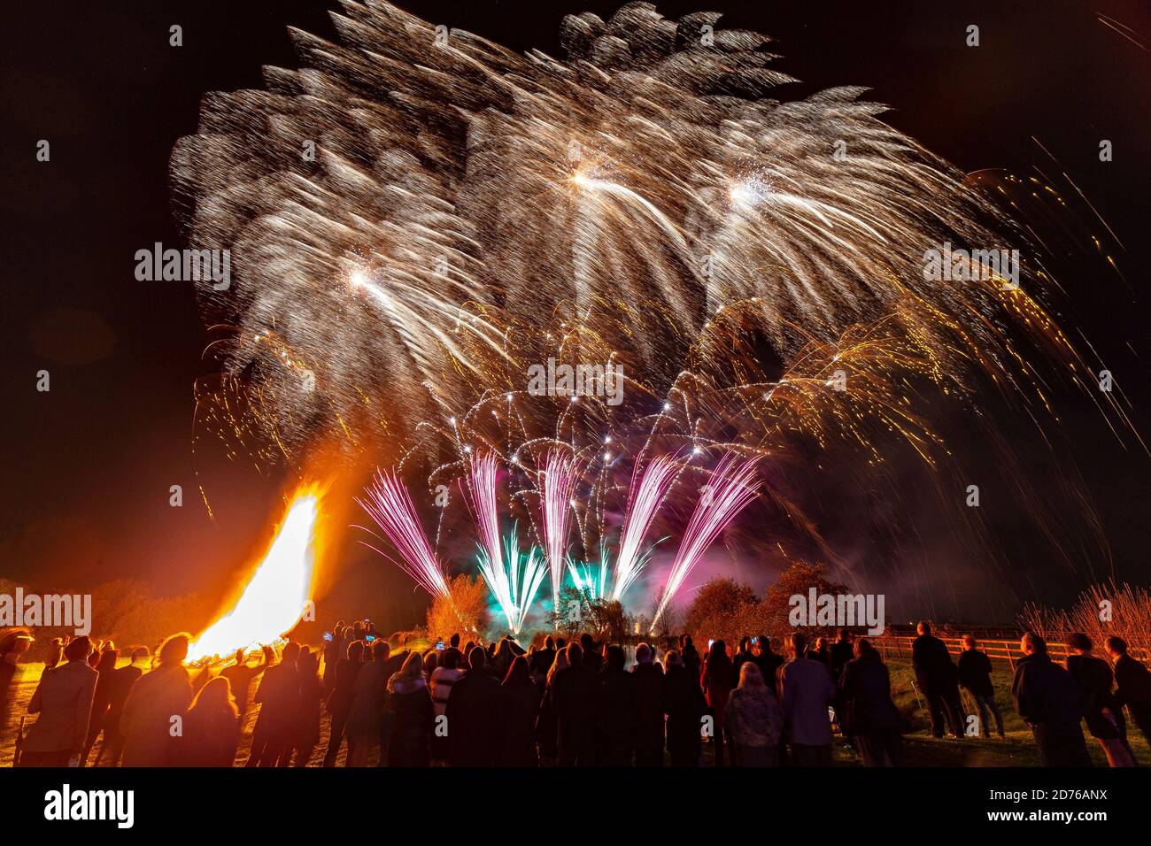 Spectacular and colourful firework display set against a dark Autumn