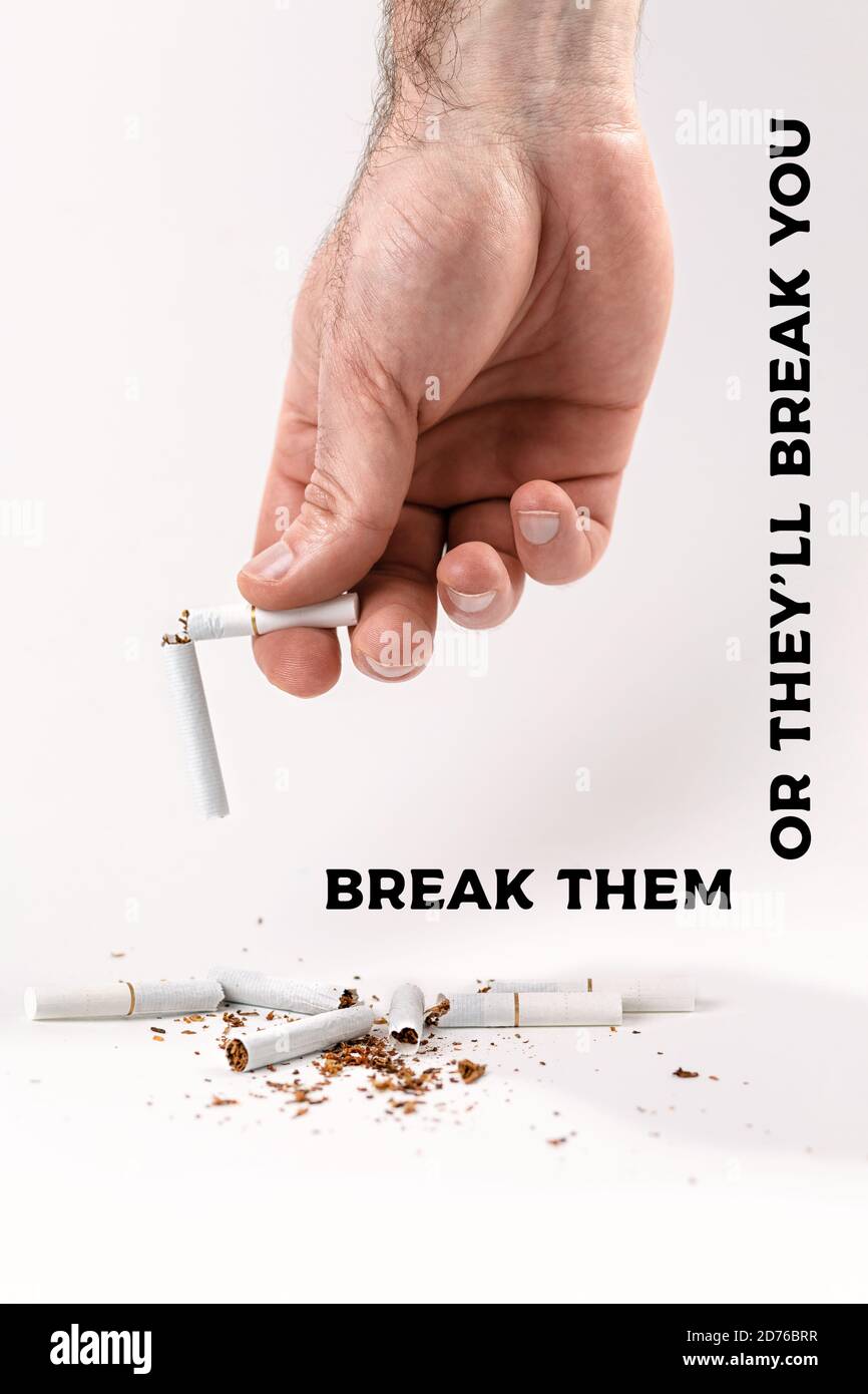 Hand holding half cigarette hi-res stock photography and images