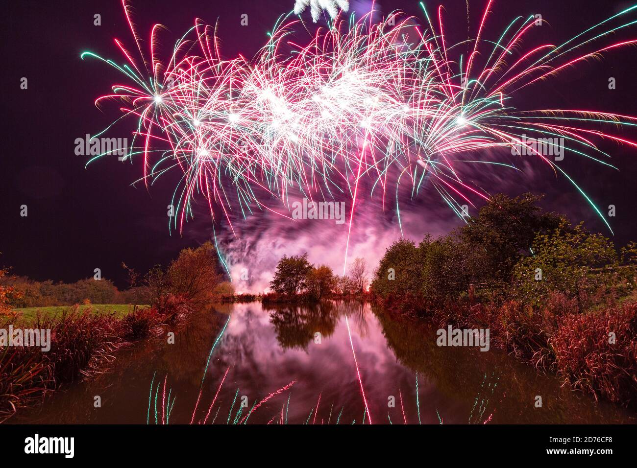 Spectacular and colourful firework display set against a dark Autumn