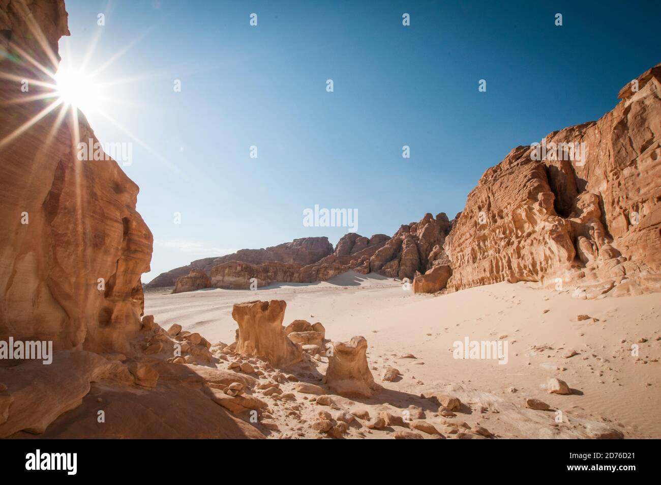 Desert landscape with blue sky and sun with sand and mountains Stock ...