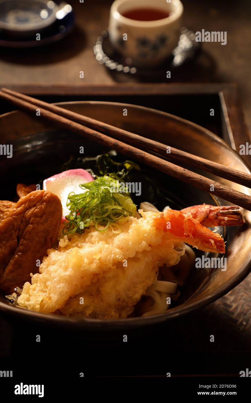 Japanese Noodle Soup of Udon with Ebi Tempura, Kitsune and Wakame Stock Photo