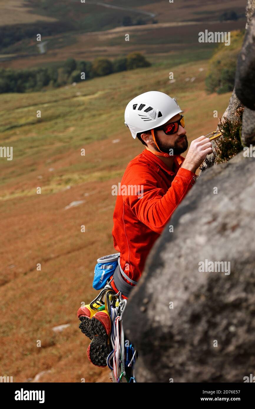 Rock climbing in Derbyshire Peak District England UK Stock Photo