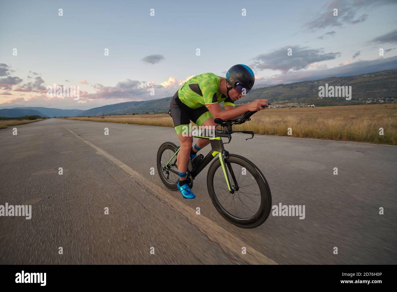 triathlon athlete riding a bike Stock Photo - Alamy