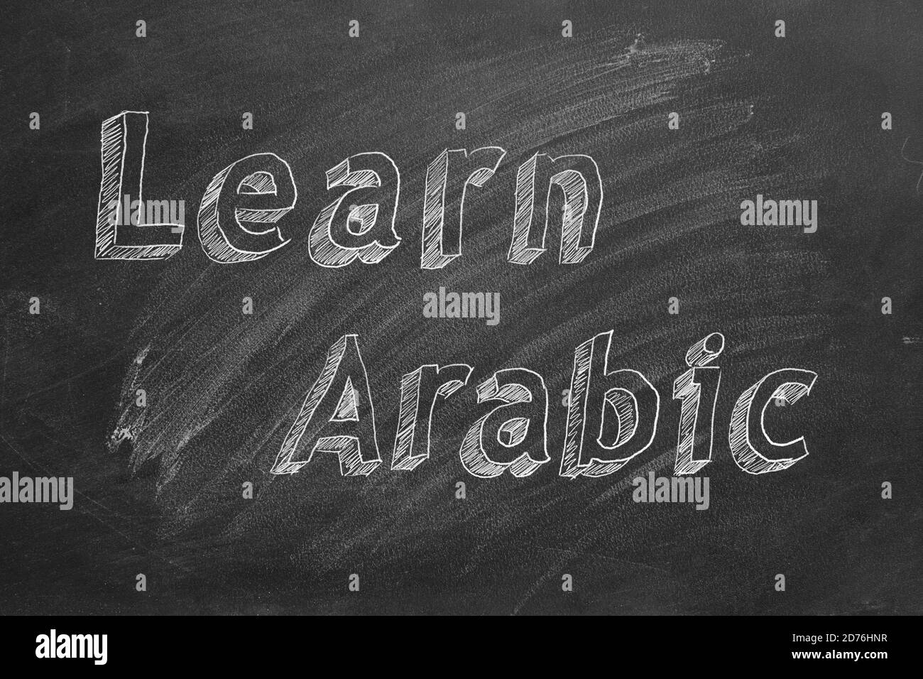 Hand drawing 'Learn Arabic' on blackboard Stock Photo