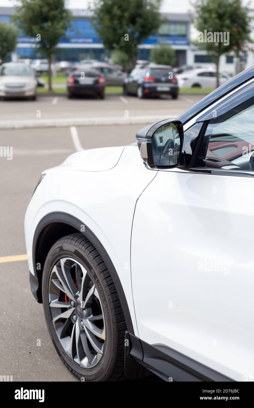 Russia, Izhevsk - August 14, 2020: Geely showroom. New modern CoolRay is standing near the dealer showroom. Car manufacturer from China. Stock Photo