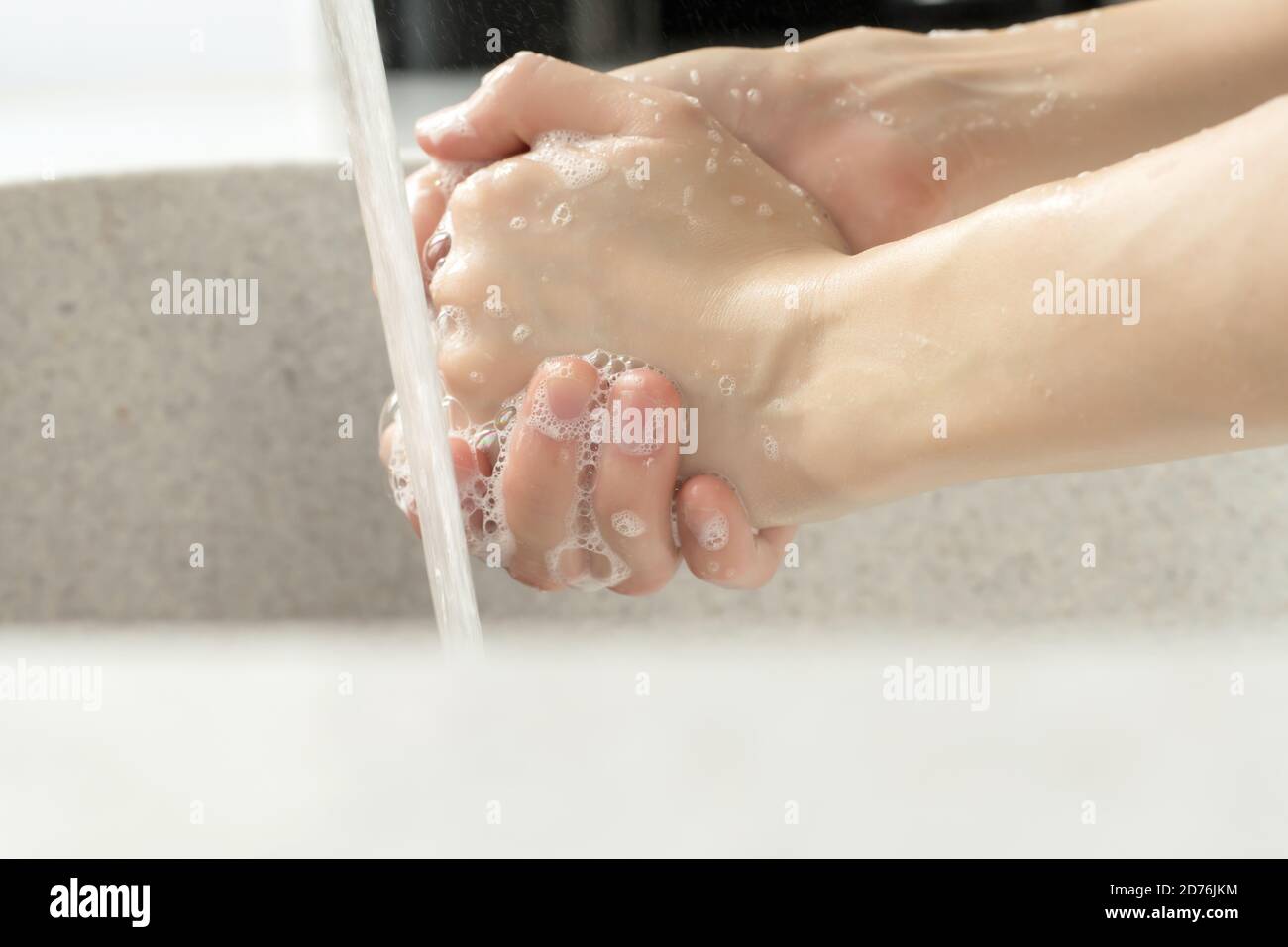 glasses of wine are stacked rhythmically in the dishwasher Stock Photo