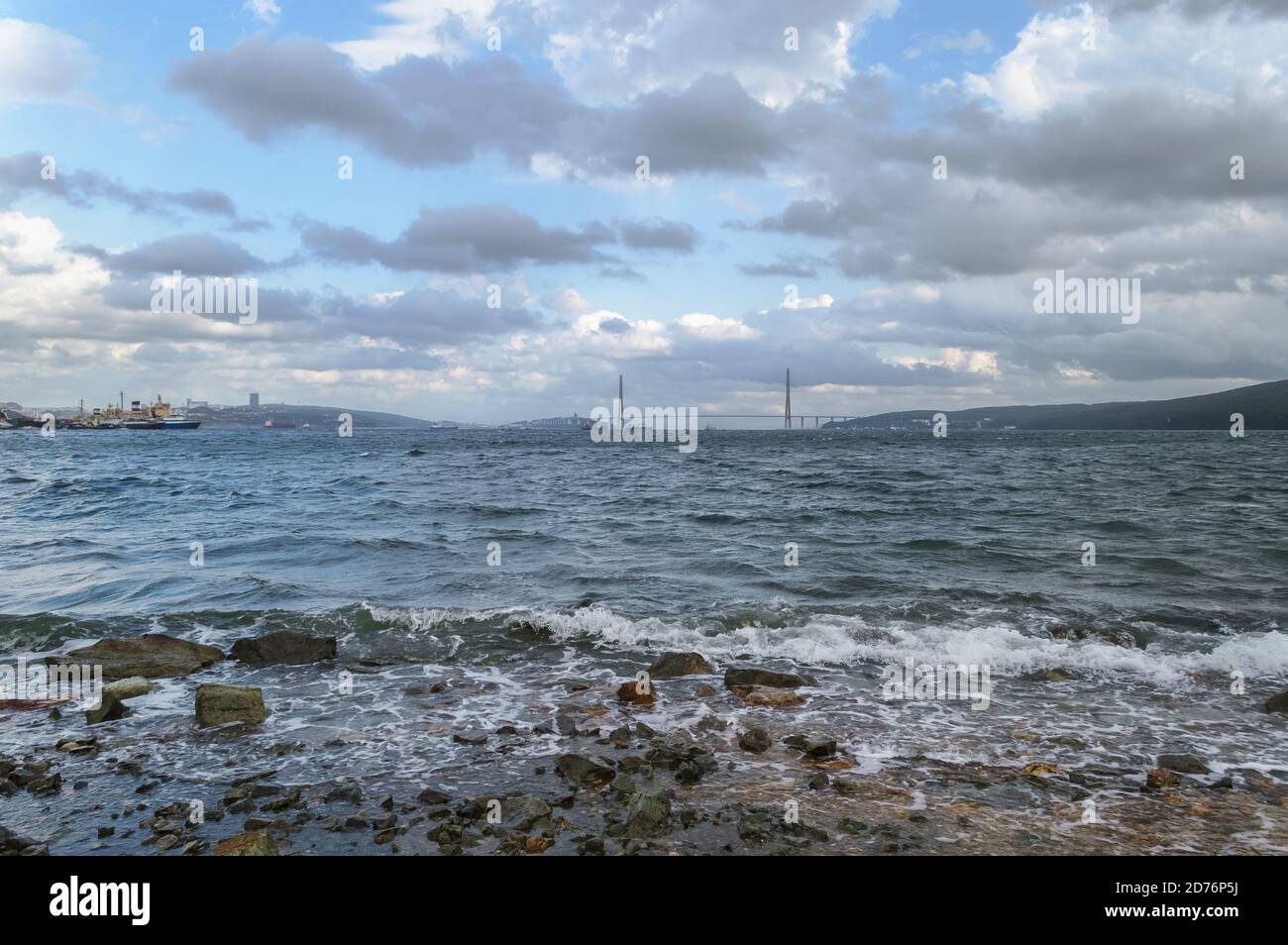 landscape with Russkiy bridge and Russkiy island on stormy day Stock Photo