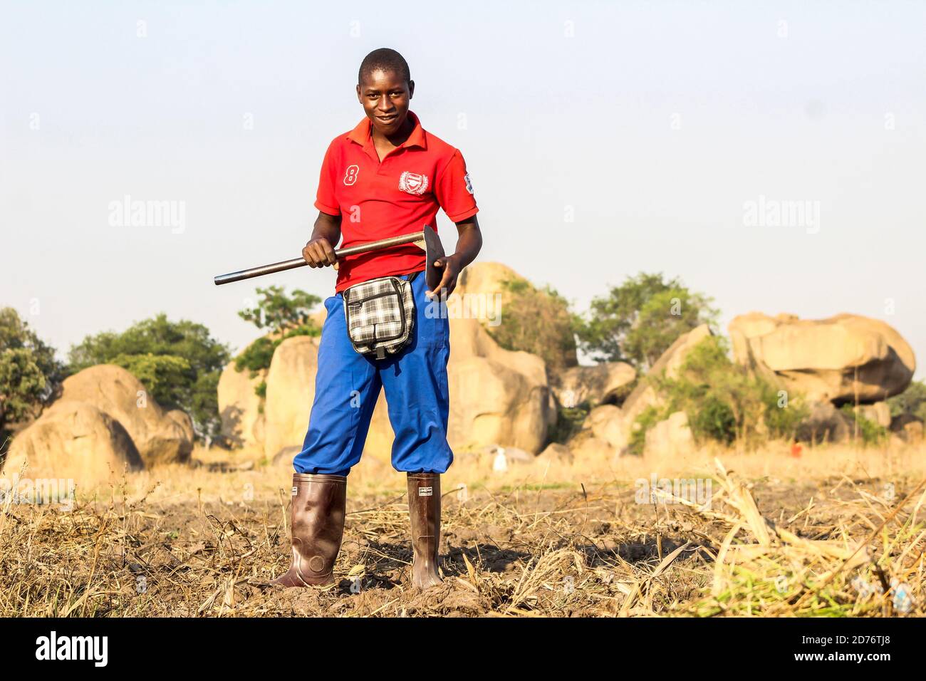 A young farmer prepares  a piece of land before the rains come, most zimbabweans are waiting for the rains so that they can begin the farming season. Zimbabwe. Stock Photo
